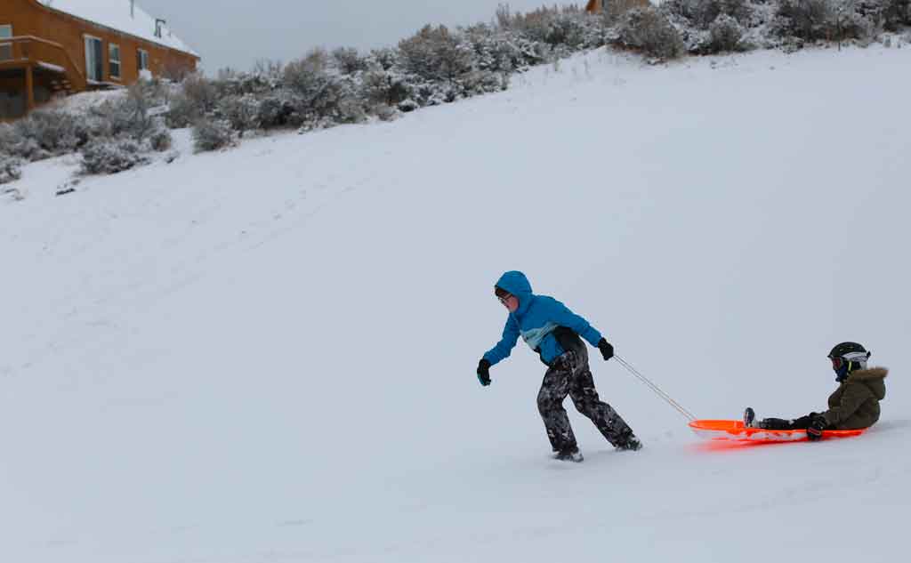Sledding is a great Christmas Activity for the whole family to enjoy