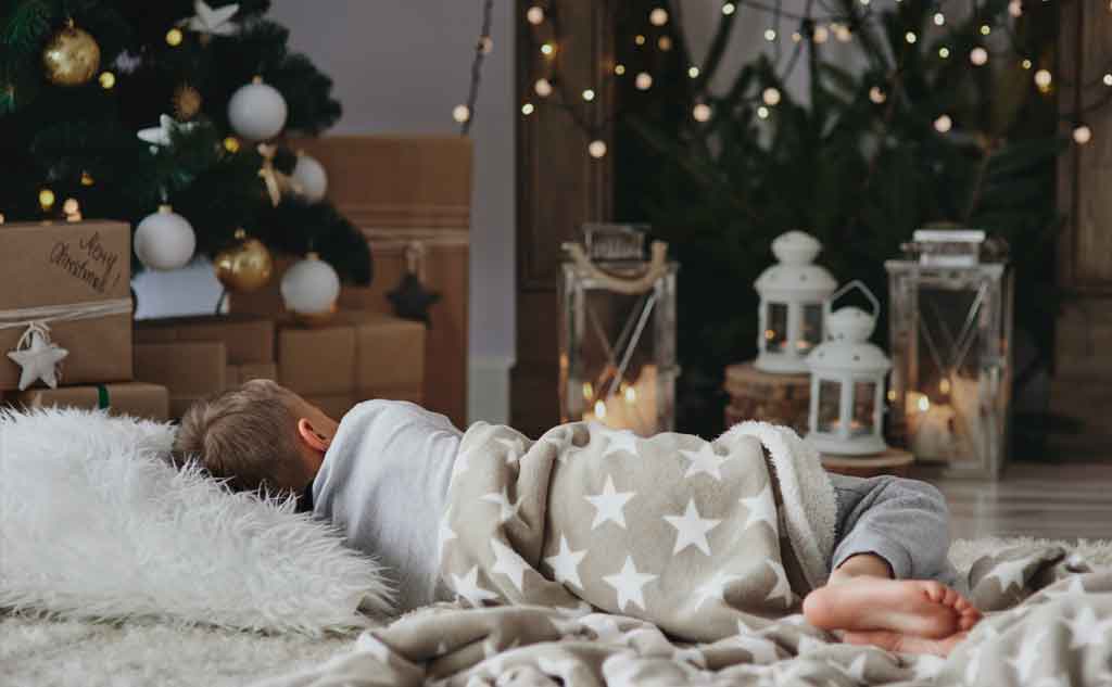 Sleeping by the Christmas Tree